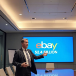GameStop CEO confronting eBay's $2.4 billion marketing budget in a high‑tech boardroom